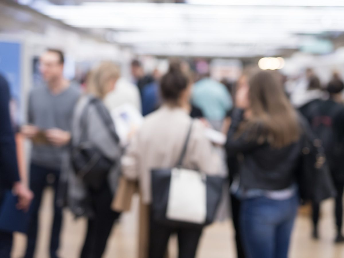 Blured image of businesspeople socializing and networking during coffee break at conference meeting. Business and entrepreneurship.